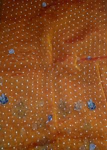 Elegant Orange Saree with White Polka Dots