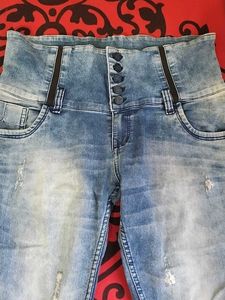 39.Distressed High-Waisted Blue Jeans