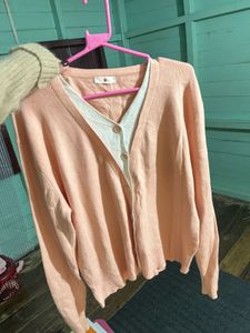 coquette pink sweater sleeve