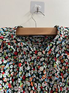 Marks and Spencer Floral Print Button-Up Tunic.