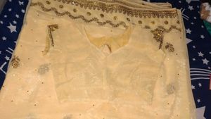 Elegant Cream Saree with Gold Embellishments