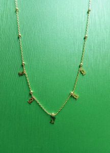 Delicate Gold Chain Necklace with Charms