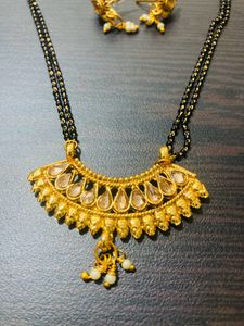 Shining Golden Mangalsutra With Ear Tops Medium Length With Stones/Diamond