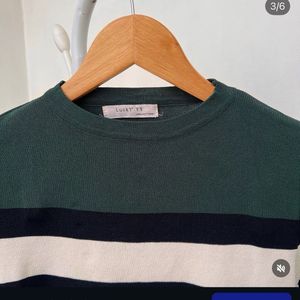 Green and White printed top.