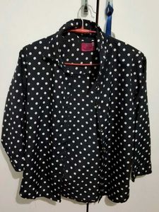 black polka dot shirt