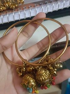 1 pair of Gold Tone Bangles with Jhumka Charms