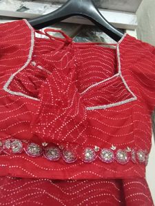 Stunning Red gand stone work saree with blause net
