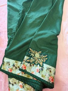 Elegant Green Saree with Floral Border