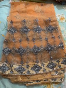 Exquisite Orange Saree with Embellishments