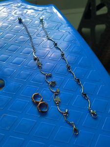 Two anklets and a pair of earings