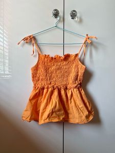 Orange Smocked Peplum Top