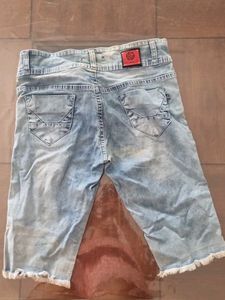 Distressed Light Wash Denim Capris