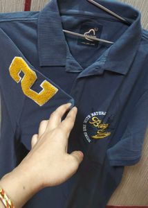 polo tshirt being human L size
