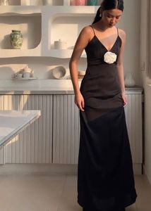 Elegant Black Dress with Floral Accent
