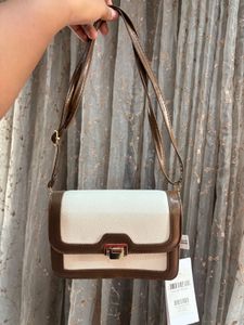 Savana sling purse