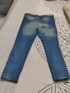 Distressed Blue Denim Jeans