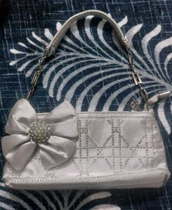 Elegant Silver Bow Clutch Bag