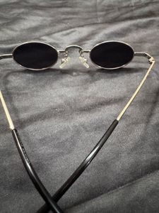 voyage black oval unisex sunglasses