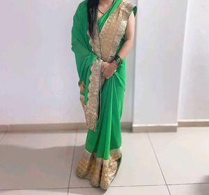 Elegant Green Saree with Golden Border
