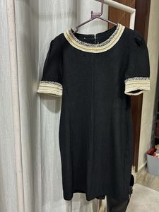 Elegant Black Dress with Embellished Neckline