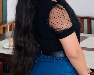 Chic Black Top with Polka Dot Sleeves