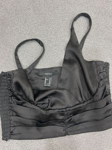black ruched off-shoulder top or bandeau-style cro