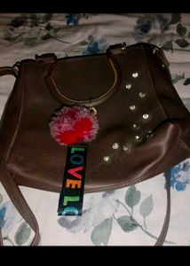 Stylish Brown Handbag with Charm