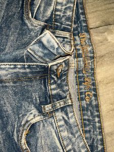 Distressed Blue Denim Jeans