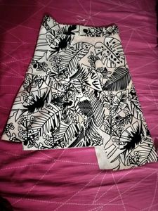 It is characterized by its bold black and white tr