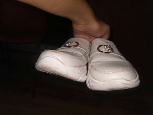 White slip-on shoes with embellishments