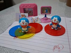 Cadbury doremon 2 figures , time tv and alb