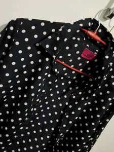black polka dot shirt