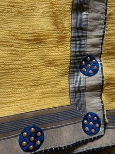 Vibrant Yellow Saree with Blue Embellishments