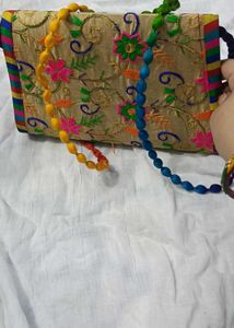 Embroidered Clutch Bag with Beaded Strap