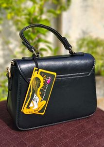 Chic Black Handbag with Gold Embellishment