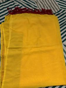 Bright Yellow saree with Red Tassels