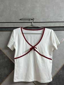 Chic White Top with Burgundy Trim & Bow Detail