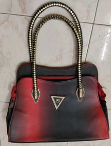 Stylish Handbag with Snake Handle Design