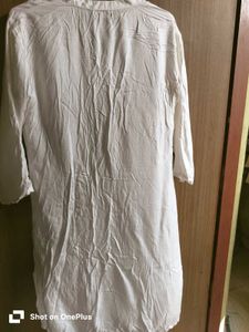 Off-white kurta with pink embroidery.y