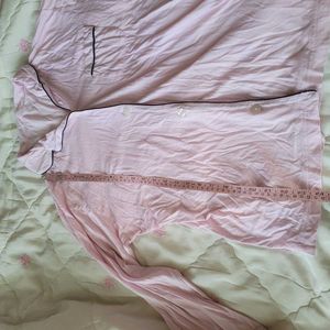 This Victoria's Secret satin pajama top features a
