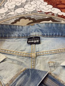 Stylish Light Blue Denim Mini Skirt with Side Tape