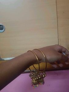 1 pair of Gold Tone Bangles with Jhumka Charms