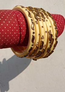 Elegant Cream Bangles with Gold Embellishments