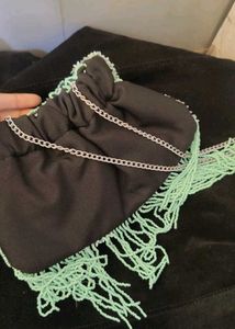 Beaded bag with tassel.