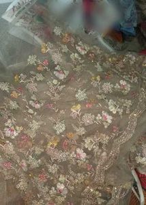 Embellished ivory net saree for engagement
