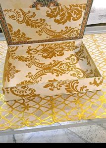 13. Decorative Gift Box with Floral Accent