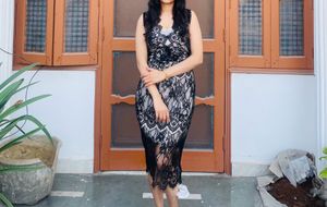 Sacarlette’s Elegant Black Lace Midi Dress