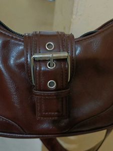 brown sling bag