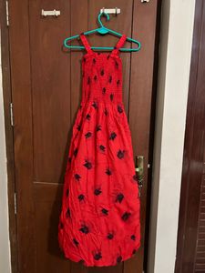 red coloured fit and flare dress with lace shrug