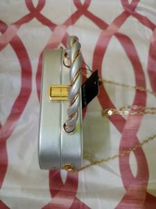 Elegant Silver Clutch with Gold Chain